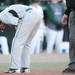 Michigan State junior Tony Wieber grimaces as he bends over in pain after his left arms was hit with a pitch as Eastern takes on Michigan State at Oestrike Stadium on Wednesday.  Melanie Maxwell I AnnArbor.com